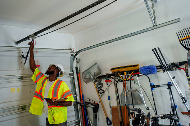 Professional Garage Door Installation technician working in St. Johns, MI